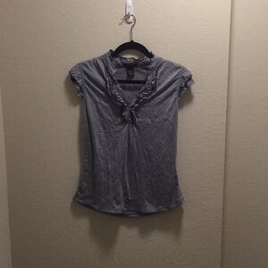 Beautiful NWOT blouse with rhinestone buttons.